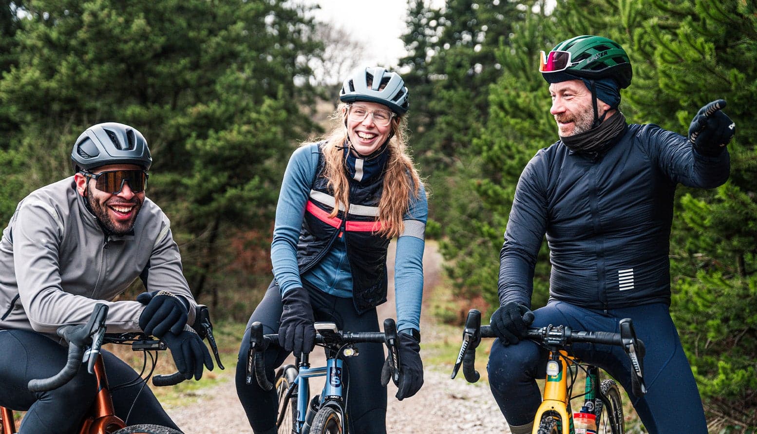 Three gravel riders having a rest and chatting