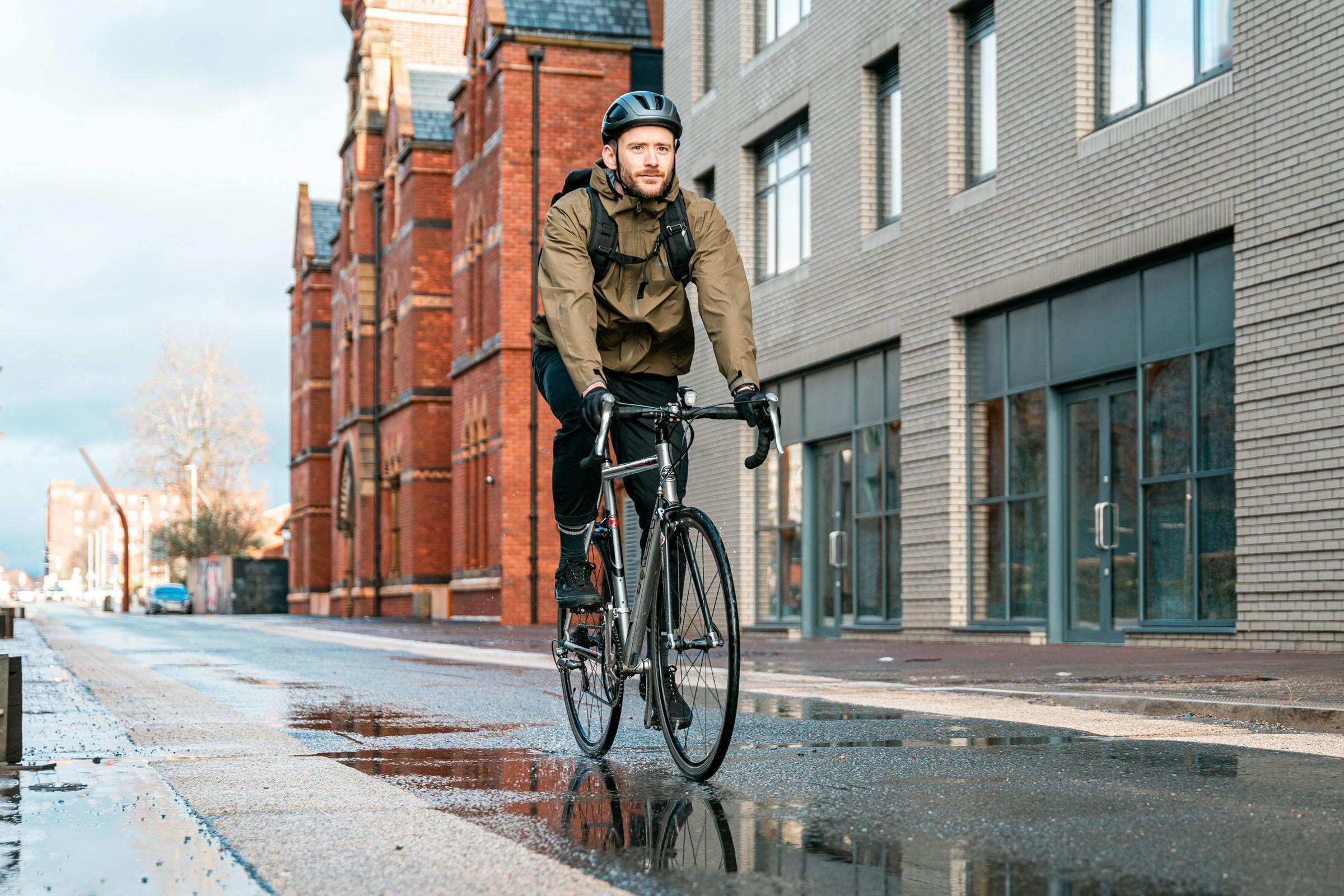 Man cycling through city
