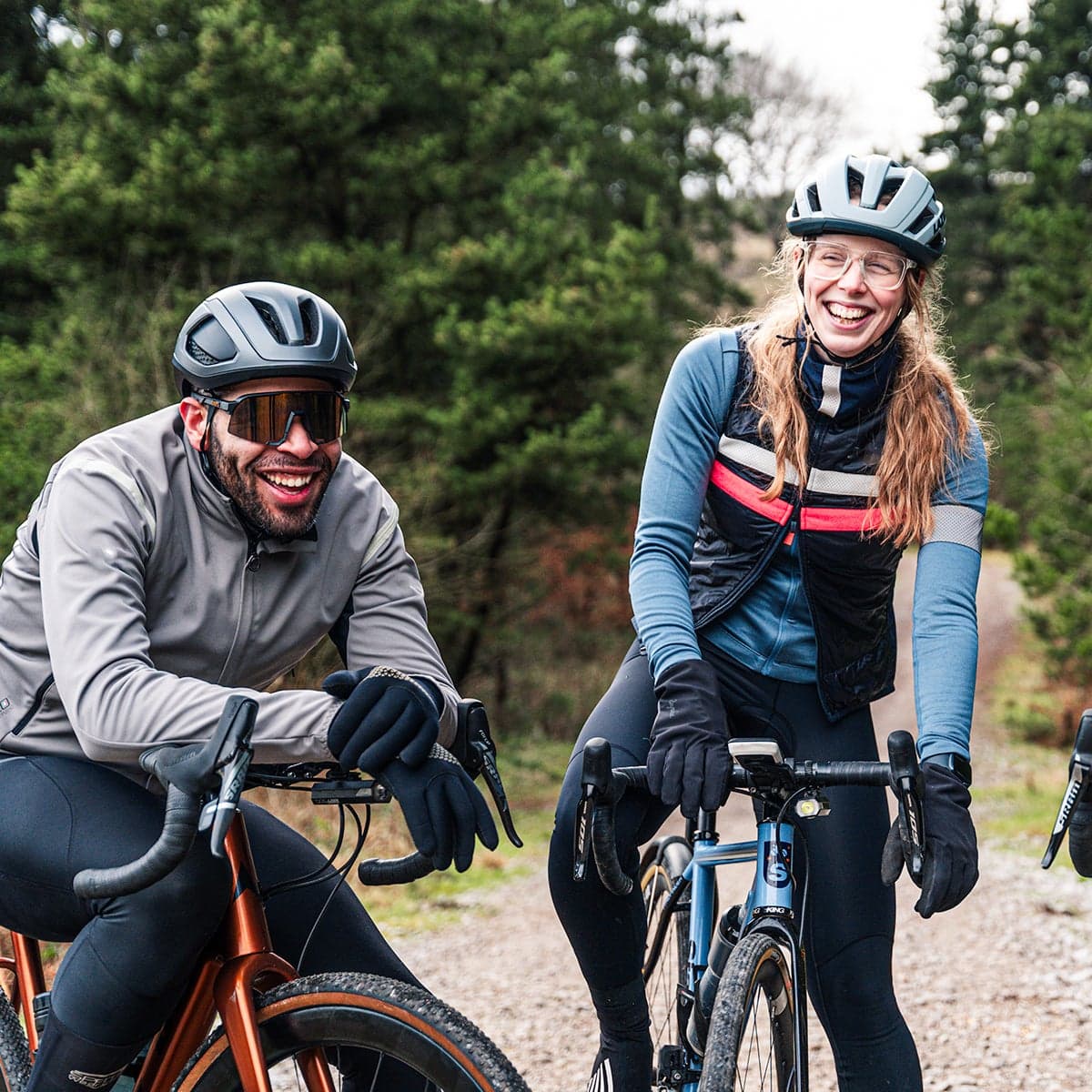A group of gravel riders on a forest path