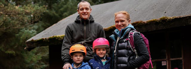 A family spectating at a mountain bike race